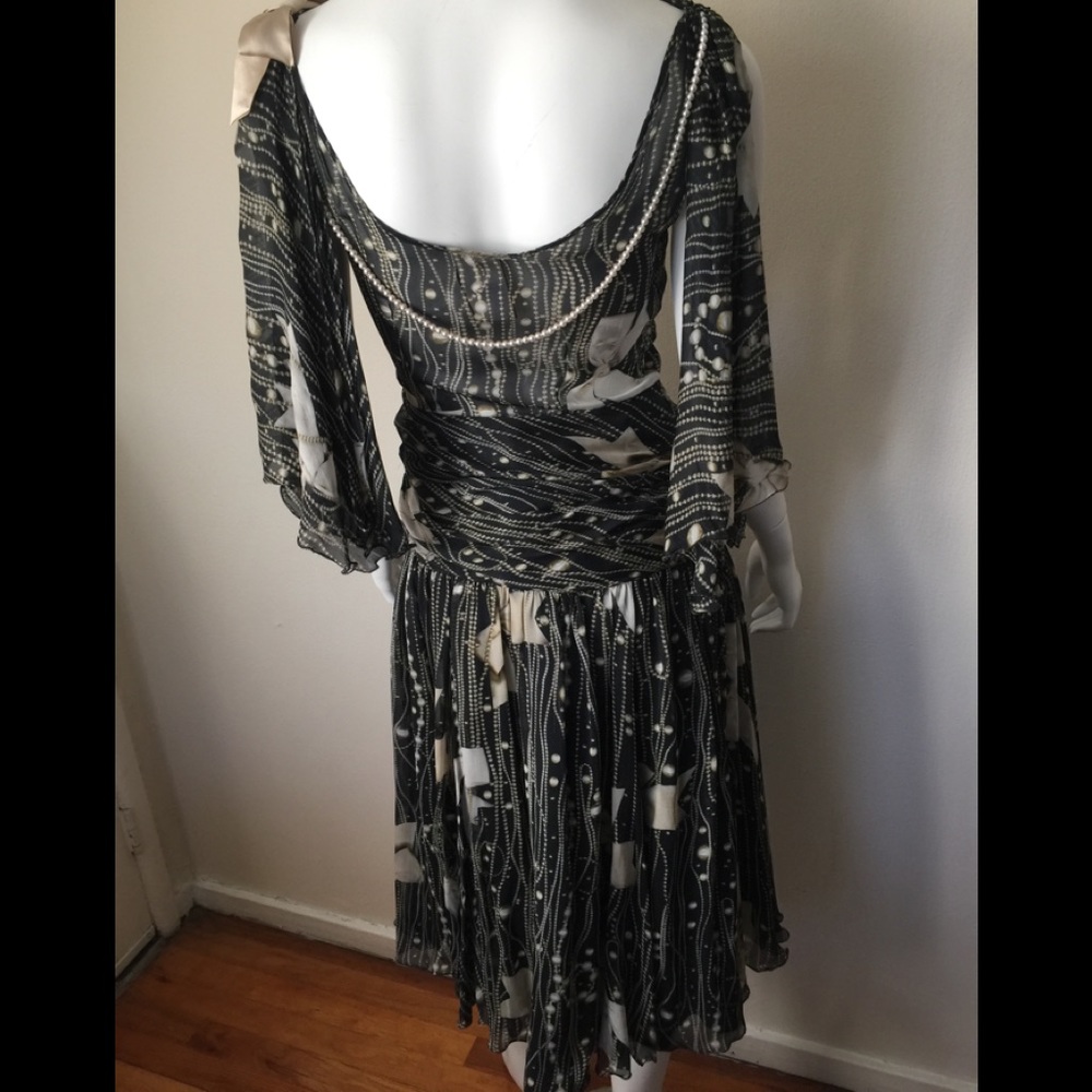 Moschino silk dress w/feminine embellishments.